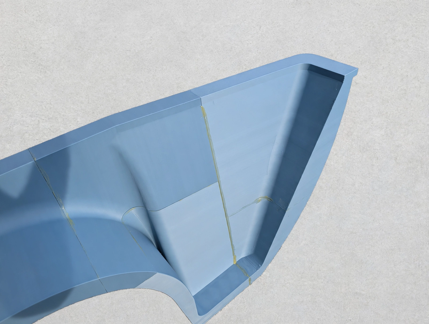 Close-up of joined FDM printed sections showing bonded seams and the printed surface