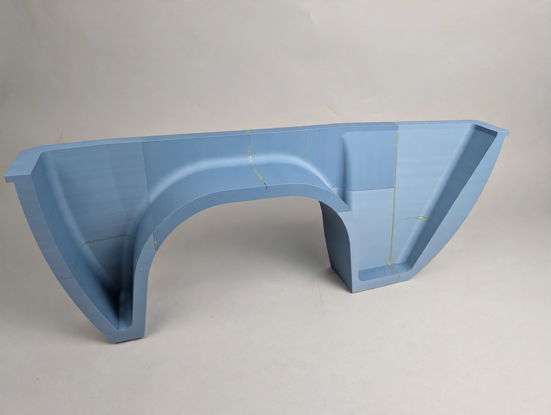 Assembled motorcycle trailer fender plug at an angle showing the complete curved structure