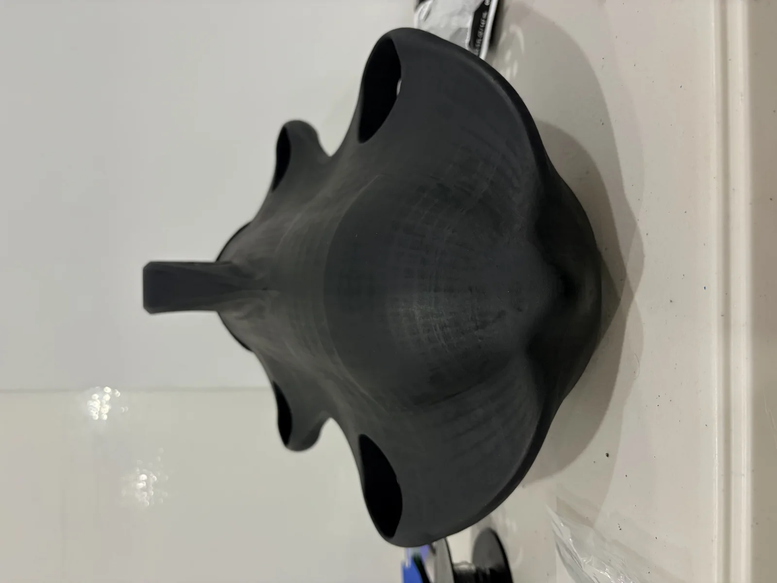 Front view of the one-piece 3D printed Pelagos Vantage V0 underwater drone hull showing the integrated thruster ducts